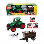 Grön traktor med släp och en söt kossa
